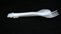 Plastic spoon and fork isolated on black background Royalty Free Stock Photo