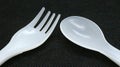 Plastic spoon and fork isolated on black background Royalty Free Stock Photo