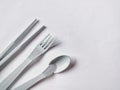 plastic spoon, fork and chopsticks on white background Royalty Free Stock Photo