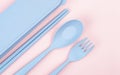 The plastic spoons, forks and chopsticks kit set on pink color background Royalty Free Stock Photo