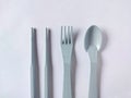 plastic spoons, forks and chopsticks on white background Royalty Free Stock Photo