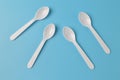 Plastic spoon isolated on a blue background Royalty Free Stock Photo