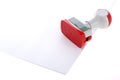 Plastic stamp over white paper Royalty Free Stock Photo