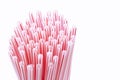 Plastic straws in a bunch isolated on a white background. Plastic waste concept