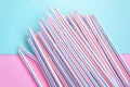 Plastic straws for cocktails. Pastel pink and blue colors. Summer vibes. Hipster party with beverages Royalty Free Stock Photo