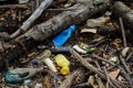 Plastic and styrofoam pollution from ocean on beach. Dirty spilled garbage waste