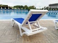 Plastic sunbed close to the swimming pool Royalty Free Stock Photo