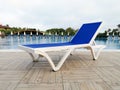 Plastic sunbed close to the swimming pool Royalty Free Stock Photo