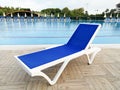 Plastic sunbed close to the swimming pool Royalty Free Stock Photo