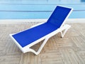 Plastic sunbed close to the swimming pool Royalty Free Stock Photo