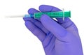 Plastic syringes and needle in hand in medical glove Royalty Free Stock Photo