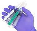 Plastic syringes and needle in hand in medical glove Royalty Free Stock Photo