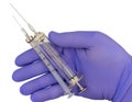 Plastic syringes and needle in hand in medical glove Royalty Free Stock Photo