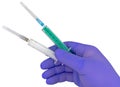 Plastic syringes and needle in hand in medical glove Royalty Free Stock Photo