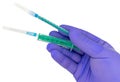 Plastic syringes and needle in hand in medical glove Royalty Free Stock Photo