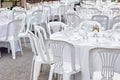 Plastic tables setting for an outdoor reception. Royalty Free Stock Photo