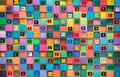 Plastic tags with clothing sizes on multi-colored squares Royalty Free Stock Photo