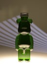 Plastic teddy bear bottle with food coloring and strange lighting effects shapes and textures Royalty Free Stock Photo