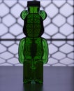 Plastic teddy bear bottle with food coloring and strange lighting effects shapes and textures Royalty Free Stock Photo