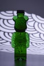 Plastic teddy bear bottle with food coloring and strange lighting effects shapes and textures Royalty Free Stock Photo