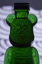 Plastic teddy bear bottle with food coloring and strange lighting effects shapes and textures Royalty Free Stock Photo