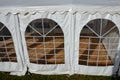 Plastic tent with wooden floor. Party tents are often impromptu rooms for vaccinating and testing patients with covid 19 diseases.