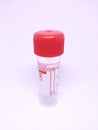 Plastic test tube with red stopper for collecting samples in the laboratory