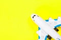 Plastic toy air plane on yellow copy space background. Top view. Travel or business trip, vacation concept. Royalty Free Stock Photo