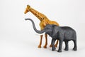 Plastic toy animals giraffe and elephant Royalty Free Stock Photo