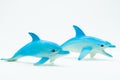 Plastic Toy Dolphins on white background Royalty Free Stock Photo