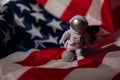 Plastic toy figure astronaut on American flag background Copy space. 50th Anniversary of USA Landing on The Moon Concept Royalty Free Stock Photo