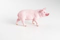 Plastic toy figurine of a pig on a white background. Royalty Free Stock Photo