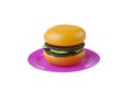 Plastic toy hamburger on the dish Royalty Free Stock Photo
