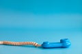 Plastic toy mobile phone on a blue background Royalty Free Stock Photo