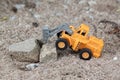 Drilling large boulders car on soil ground. Royalty Free Stock Photo