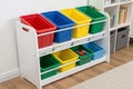 Plastic toy organizer with color-coded bins