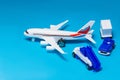 Plastic toy plane on blue background Royalty Free Stock Photo