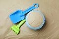 Plastic toy set with shovel on sand Royalty Free Stock Photo