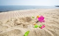 Plastic toys on the sand Royalty Free Stock Photo