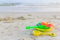 Plastic toys sand on the sea beach background. Royalty Free Stock Photo