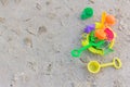 Plastic toys sand on the sea beach background. Royalty Free Stock Photo