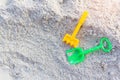 Plastic toys sand on the sea beach background. Royalty Free Stock Photo