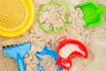 Plastic toys in sandpit Royalty Free Stock Photo