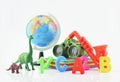 Plastic toys on white background, children explore concept