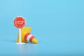 Plastic traffic cone and stop sign. Copy space for the text Royalty Free Stock Photo