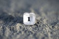 plastic translucent button number one from an old calculator on a concrete background Royalty Free Stock Photo