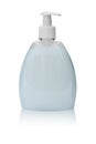 Plastic transparent bottle with a dispenser filled with liquid soap or shampoo. Isolated on a white background with reflection Royalty Free Stock Photo