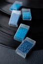 Plastic transparent boxes with blue beads inside