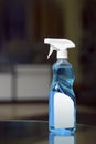 Plastic transparent sprayer with blue liquid and white elements Royalty Free Stock Photo