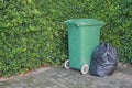 Plastic trash bags and rubbish bin in a park Royalty Free Stock Photo